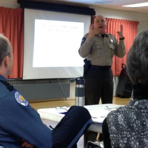 Lincoln County Sheriff's Deputy Mark Bridgham gives an animated portrayal of someone under the influence of drugs. SUSAN JOHNS/Wiscasset Newspaper