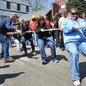 Doug Carter cheers on the women's division winners from Sea Pier. BEN BULKELEY/Boothbay Register