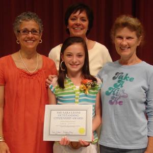 Emily Harris is surrounded by, from left, Madeline Olney (guidance counselor), Lisa Clarke (principal) and Carol Leone (mother of the late Sara Leone). Courtesy of Edgecomb Eddy School