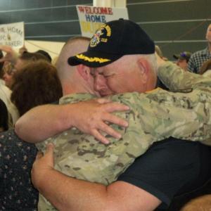 Peter Greenleaf hugs his son, Pvt. Nick Greenleaf, upon his return to Maine June 15. Courtesy of Isaac Luken