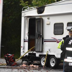 A newly acquired camper parked in a driveway caught fire Thursday evening. (Photo by Sarah Thompson)