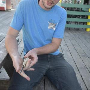 The shucking contest winner shows off his knife. 