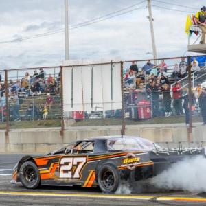 Bubba Pelton does a burnout on the front stretch after winning the feature race and the Super Street championship.  Jasen Dickey Photography