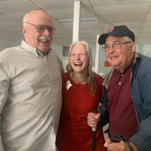 2025 Maine Teacher of the Year Becky Hallowell, who teaches fourth grade at Wiscasset Elementary School, is flanked by her uncles Michael “Jim” Bilinsky, left, and Daniel Fortin at a reception after Hallowell learned she’d won the statewide honor. SUSAN JOHNS/Wiscasset Newspaper 