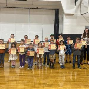 Kindness Award Winners: Front: Ryleigh Gagnon, Adelaide Walsh, Noa Stevenson, Jaxon Gage, Vivien Hedstrom, Matthew Hawkins, Trenton Adams. Back: Lorelei Walsh, Juliette Johnson, Evelyn Fish, Essie Ross, Justin Chen, Wyatt Earley, Derrick Corson, Wyatt Hendron, Principal Ainslee Riley.