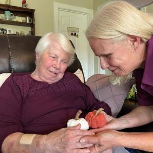 Caregiver Kim Greene-Labranche interacts with Ginny Cardner at her home in Gorham.