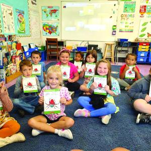 First graders with new books 