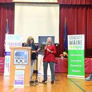 Maine Education Commissioner Pender Makin hands Hallowell the award for Maine Teacher of the Year. SUSAN JOHNS/Wiscasset Newspaper 