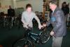 Mason Arthur Richardson hands off one of the bikes to Riley Sullivan. KEVIN BURNHAM/Boothbay Register