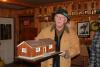 Earl Leavitt holds a miniature clubhouse that was placed in local businesses to raise money to reshingle the clubhouse in 1954. SUE MELLO/Boothbay Register