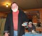 Former President Dennis Blackman was "honored" with a tipped over boat off the cake to commemorate his falling overboard while fishing. SUE MELLO/Boothbay Register