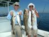 Steve Rubicam, left, of East Boothbay, and Bob Damrell, of Georgetown, display a couple of cod, a pollock, and a haddock, part of a nice catch of bottom fish they boated out on Plattes  Bank on July 15. Courtesy of Capt. Barry Gibson