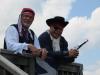 Alan Boyes, left, of Boothbay and Don Davis of Wiscasset watch July 4 festivities from the Wiscasset Yacht Club deck. SUSAN JOHNS/Wiscasset Newspaper