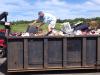 Fishing of another kind. Rotarian Ham Meserve fishes around the dumpster at the Waste Management Facility on Saturday, Aug. 3. He misplaced a briefcase at the Rotary Auction and thought it may have been hauled off to the dump. Luckily, the briefcase was later found at the auction site. Courtesy of Chip Griffin