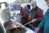 Firefighters cook the hamburgers and hot dogs on the grill. KEVIN BURNHAM/Boothbay Register