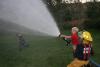 It was warm enough to run under the fire hose during the open house. KEVIN BURNHAM/Boothbay Register 